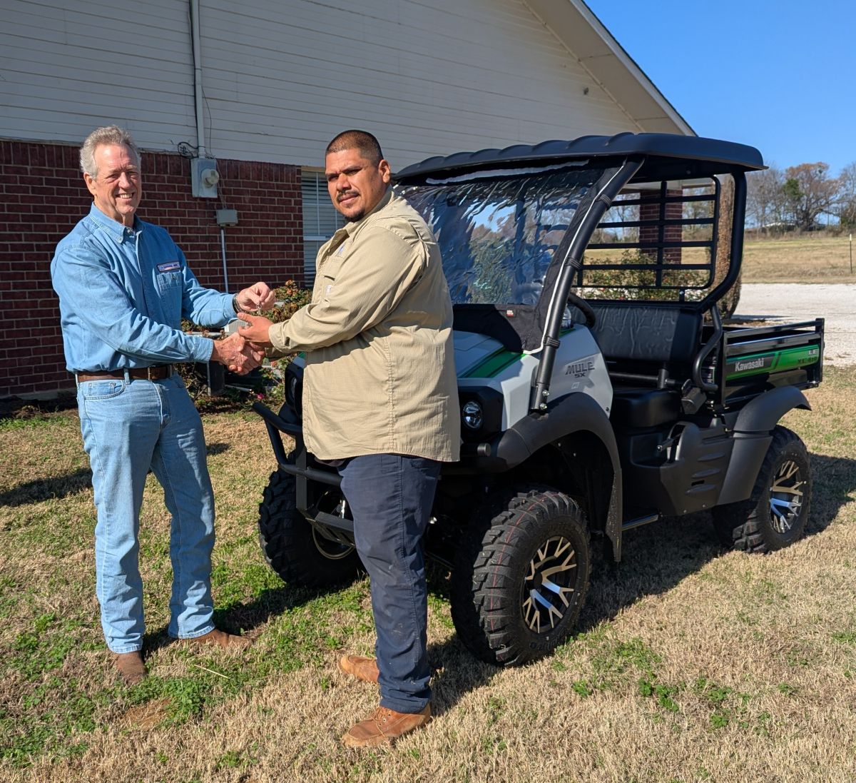 Councilman Selby handing keys for new meter reading vehicle to Water Supt. Ruben Servin